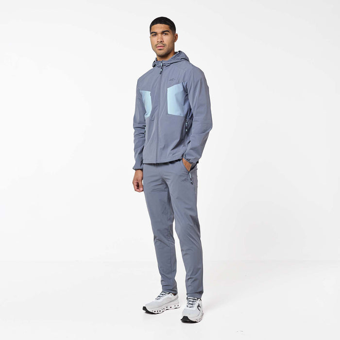 Gradient Motion Tracksuit in Charcoal/Mint, featuring a charcoal hooded jacket with contrasting mint chest panels, zip pockets and matching tapered pants.