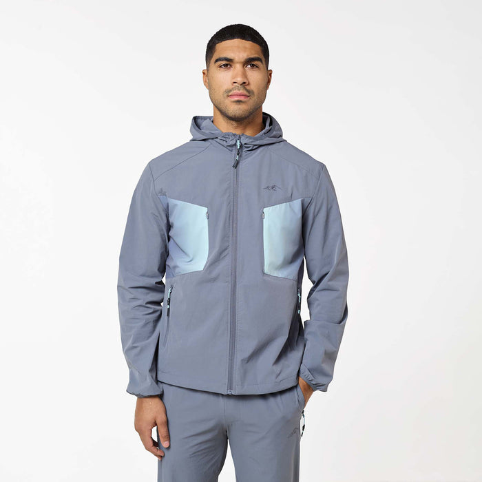Gradient Motion Tracksuit in Charcoal/Mint, featuring a hooded charcoal jacket with contrasting mint chest panels, multiple zip pockets and subtle Closure branding.