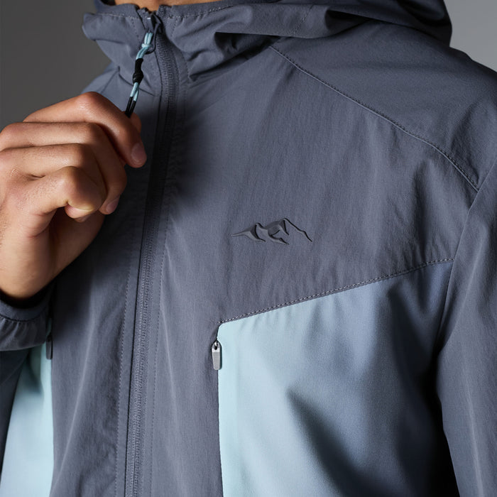 Close-up of the Gradient Motion Tracksuit jacket in Charcoal/Mint, highlighting high-build Closure branding, contrast mint chest pocket and zip detailing.