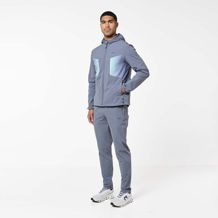 Gradient Motion Tracksuit in Charcoal/Mint, featuring a charcoal hooded jacket with contrasting mint chest panels, zip pockets and matching tapered pants.