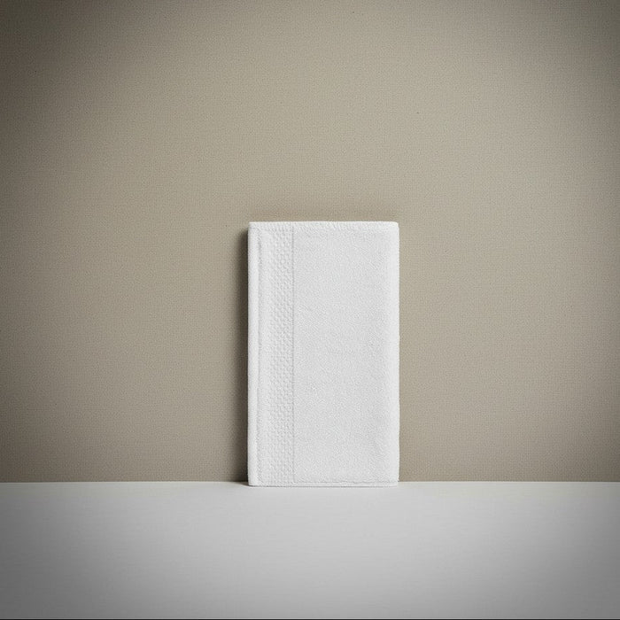 White notebook on a beige surface with a neutral background