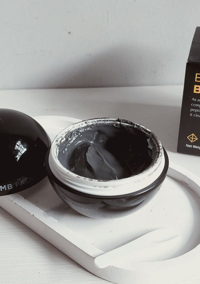 Packaging of GSLEY Bubble Bomb Pack which is a black spherical container with product details in white and red text, presented alongside its box which has similar color scheme and branding.