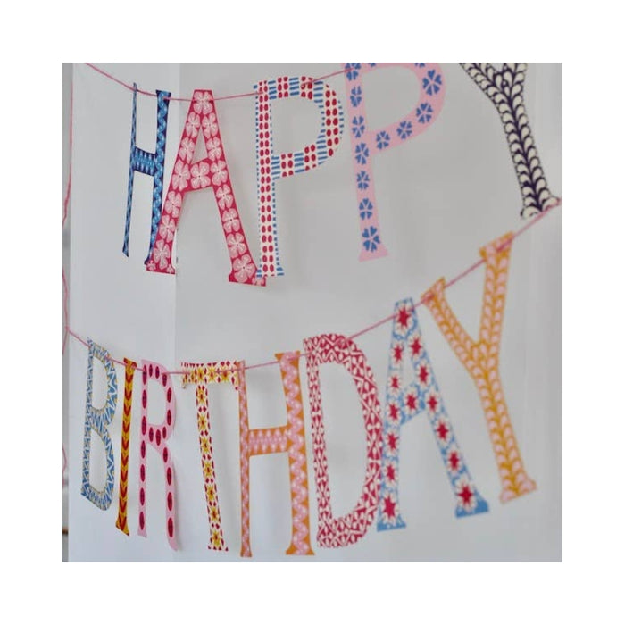 Colorful 'Happy Birthday' banner with patterned letters on a white background