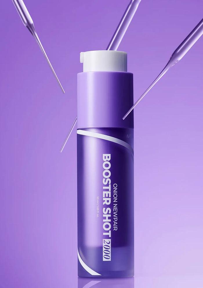 Purple bottle labeled 'Booster Shot' on a purple background