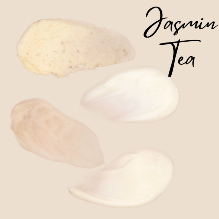 Swatches of Jasmine Tea manicure scrub, lotion and creams on a pale orange background