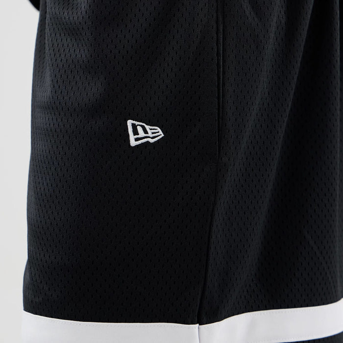 The model is wearing these MLB Mesh LA Dodgers Oversized Shorts in black. 5