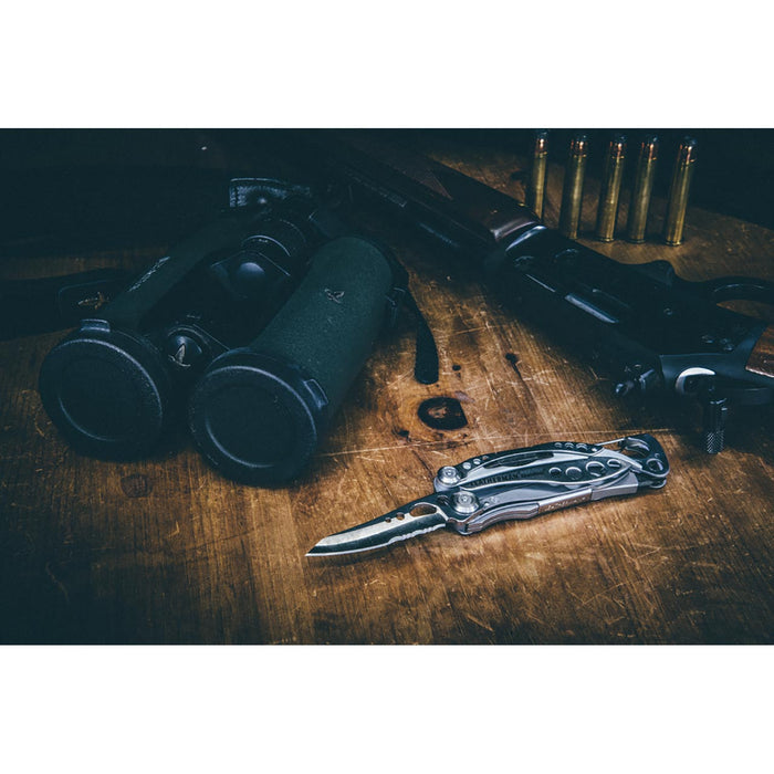 Leatherman Skeletool CX, with gun and binoculars