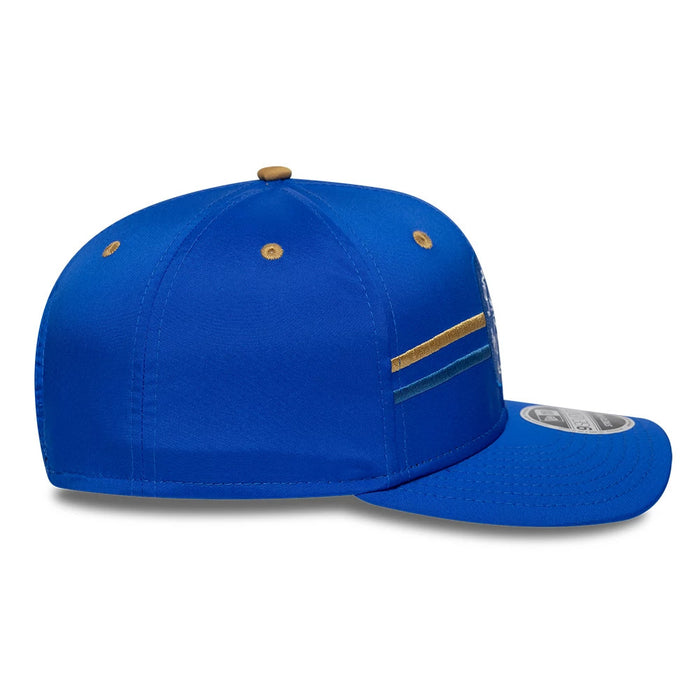 Pictured is this The Hundred 2026 MI London 9SEVENTY Stretch Snap Adjustable cap in bright blue. 5