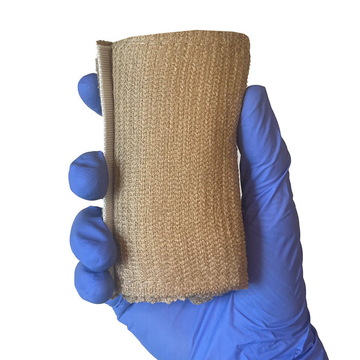 Rescue Essentials Mini Compression Bandage, rolled in hand
