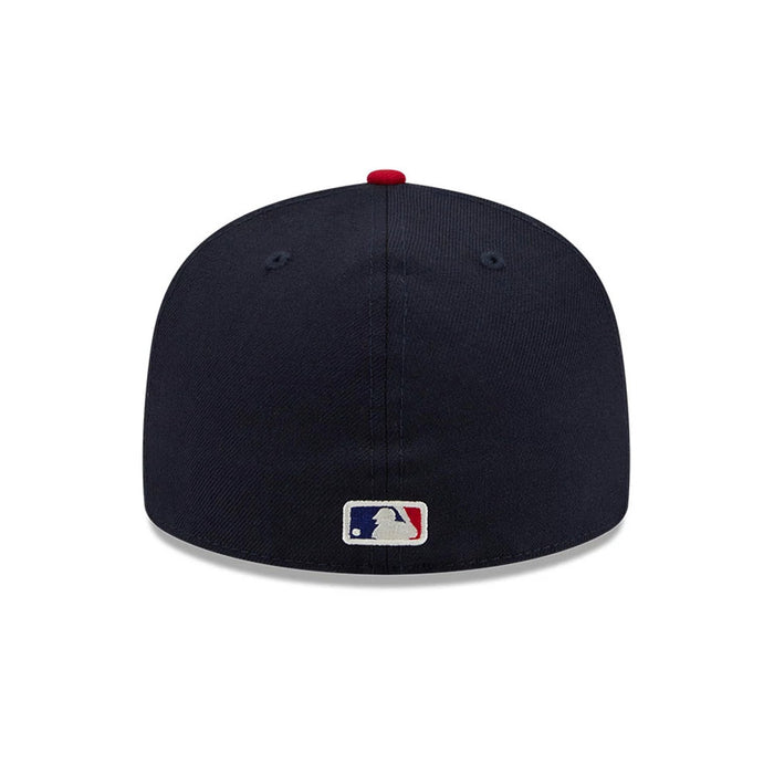 Pictured is this Fear Of God X MLB Logo 59FIFTY Fitted cap in navy & red. 7