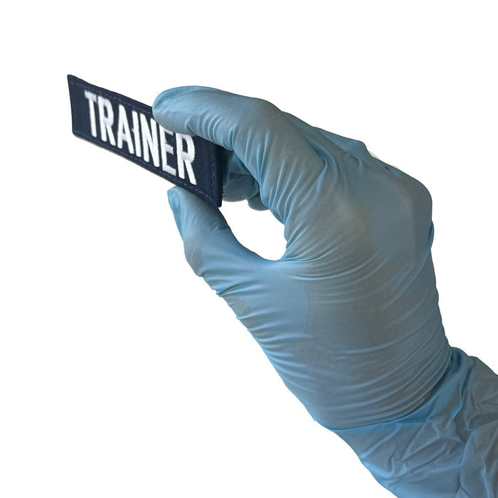 TRAINER Name tape, Front angled in hand