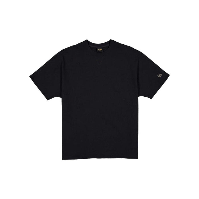 The model is wearing this New Era Black Label Seersucker T-Shirt in black. 1