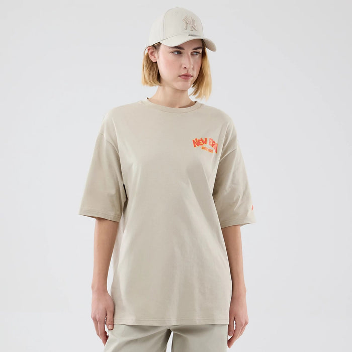 The model is wearing this New Era Food Graphic Oversized T-Shirt in light beige. 4