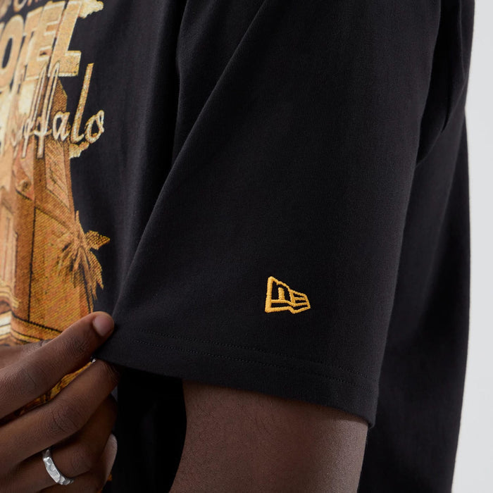 The model is wearing this New Era Motor Graphic Oversized T-Shirt in black. 5