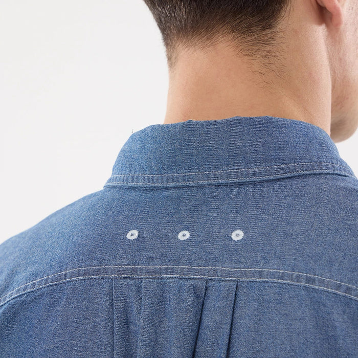 The model is wearing this New Era Originators Chambray Short Sleeve Shirt in dark blue. 7
