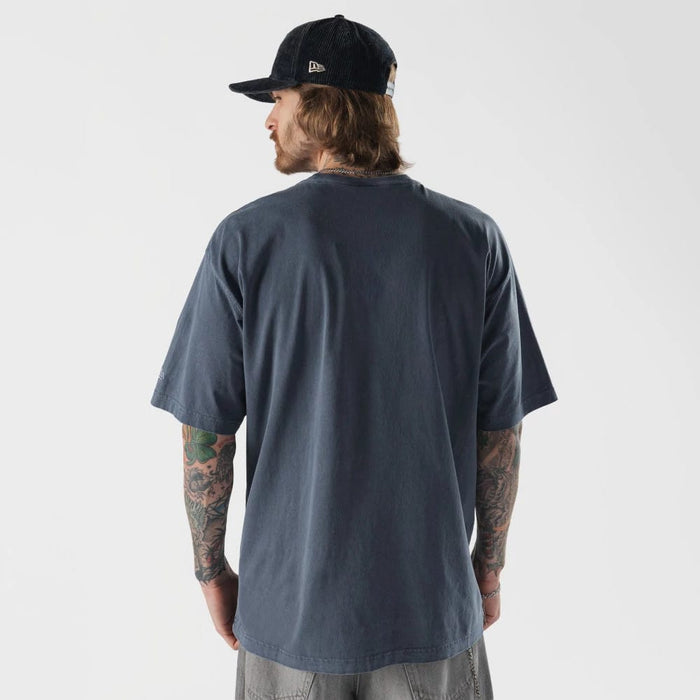 The model is wearing this New Era Originators T-Shirt in navy. 2