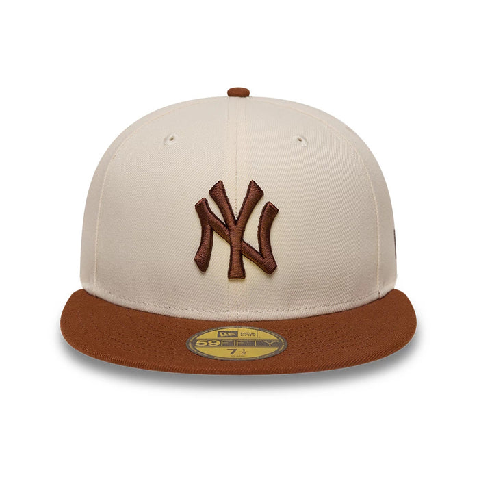 Pictured is this MLB League Essential New York Yankees 59FIFTY Fitted cap in cream. 2