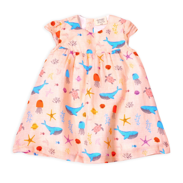 Front of Ocean Bora Bora Ruffled Cap Sleeve Dress+ Bloomer Set made of Organic Muslin