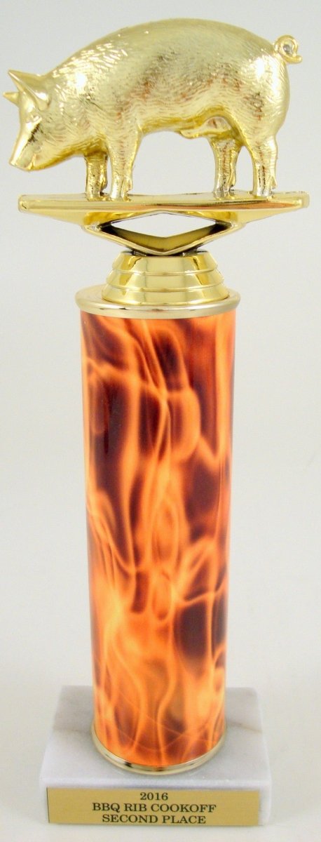 A gold-colored trophy featuring a flying pig motif atop a flame column, with an engraved plate at the base.