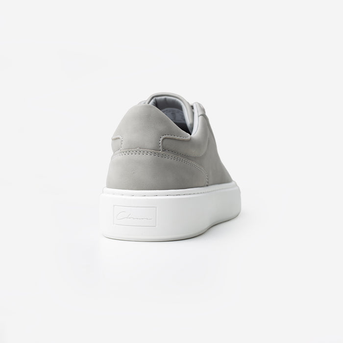 Rear view of the Premium Classic Trainer in Grey, highlighting the grey faux suede heel panel and debossed Signature Closure London branding on the white cup sole.