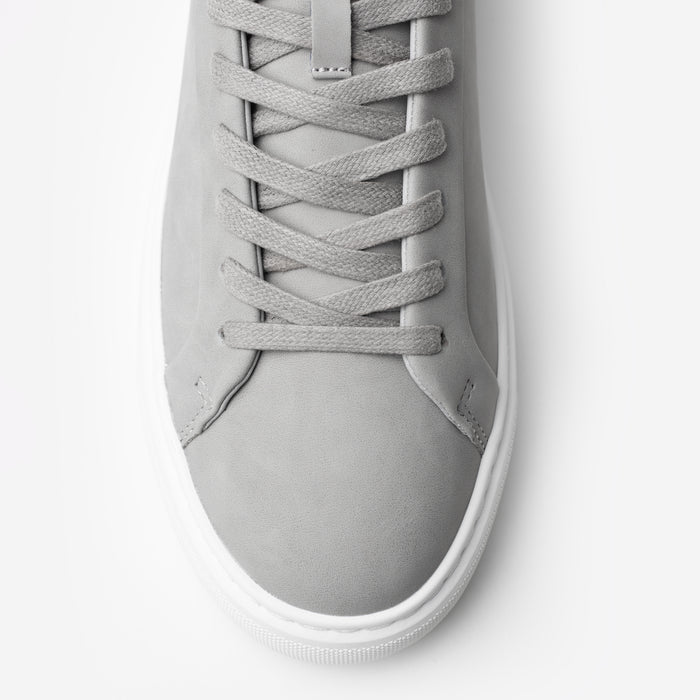 Top-down close-up of the Premium Classic Trainer in Grey, highlighting the grey lace-up fastening, smooth PU upper and stitched toe detailing.