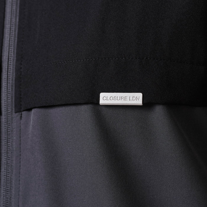 Premium Performance Jacket in charcoal and black – Closure LDN branded tab detail