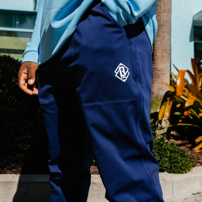 Adult model wearing navy and white Pro Series Active Pants pants
