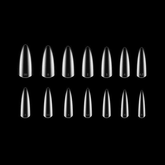 Set of clear nail tips on a black background