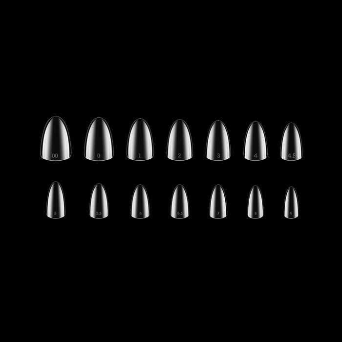 Set of clear nail tips on a black background
