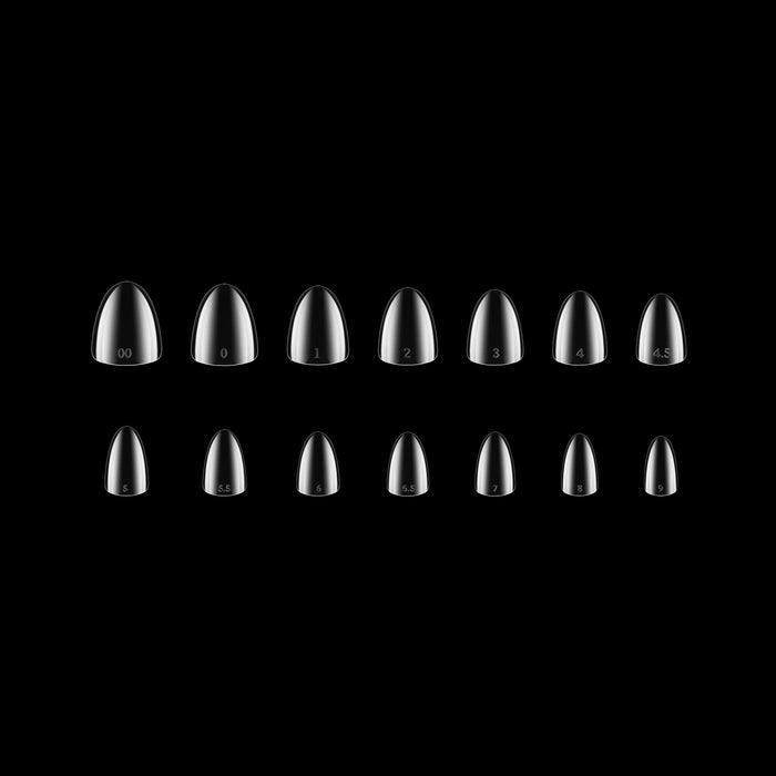 Set of clear nail tips on a black background