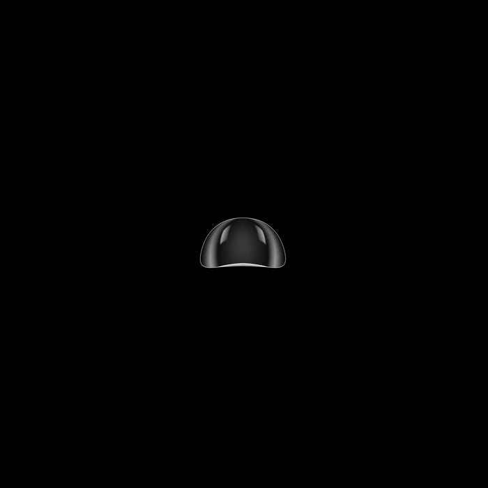 Clear nail tip on a black background