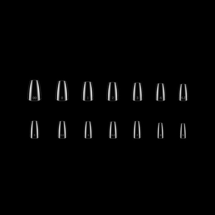 Row of clear nail tips on a black background