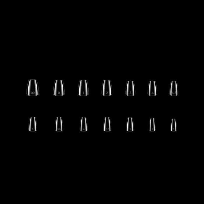 Multiple clear nail tips on a black background