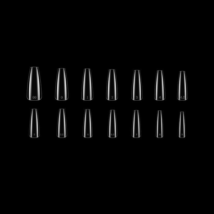 Row of clear coffin nail tips on a black background
