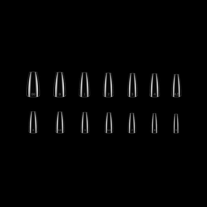 Row of clear coffin nail tips on a black background