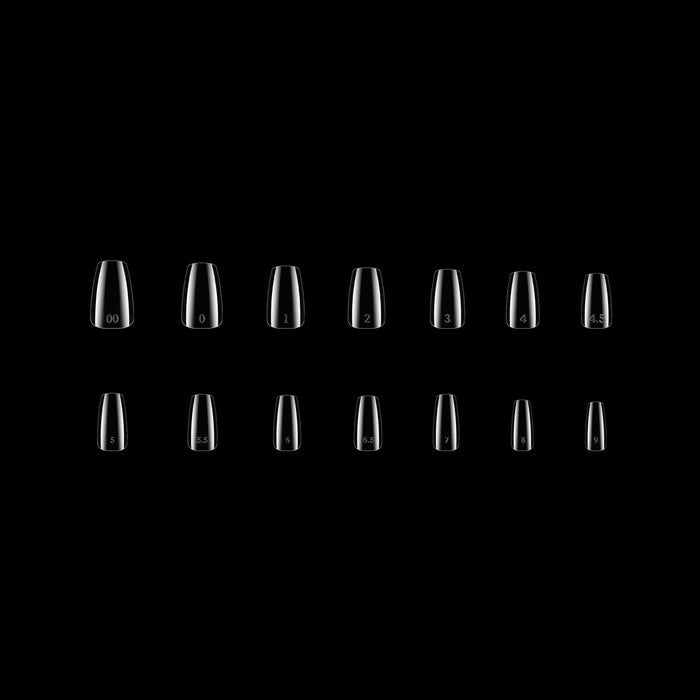 Set of clear nail tips arranged in a grid on a black background