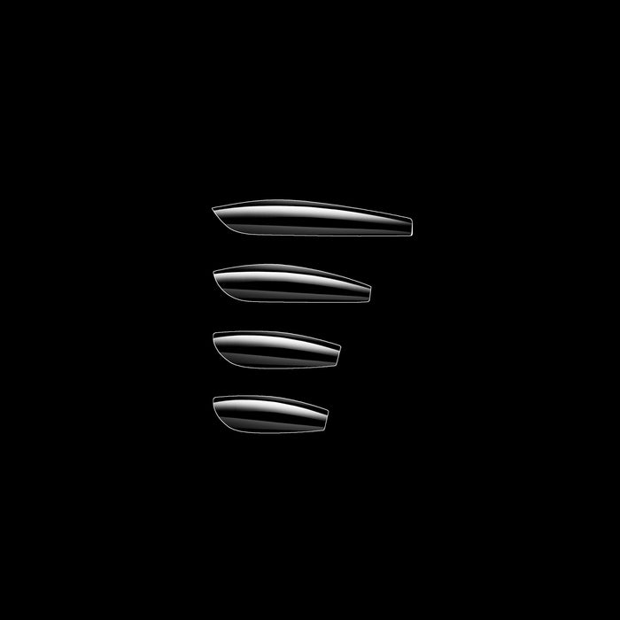 Set of four clear coffin nail tips on a black background