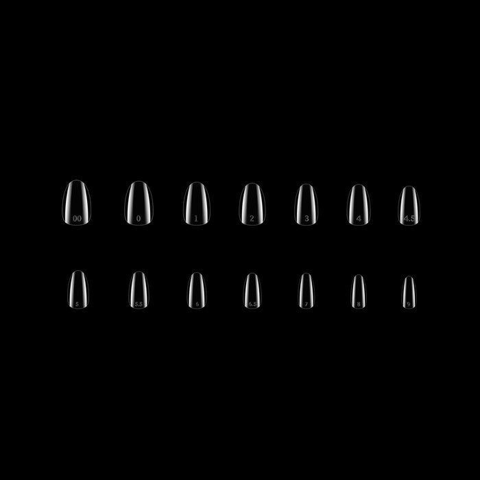 Set of clear nail tips on a black background