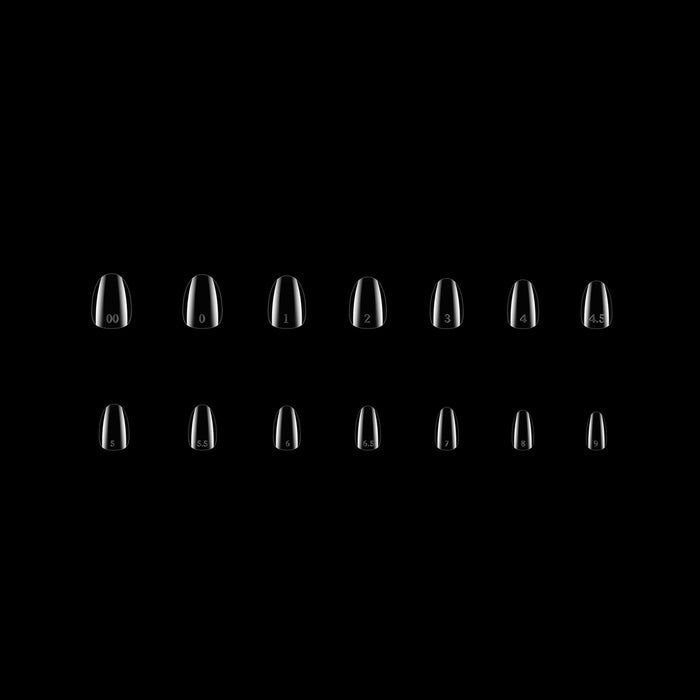 Set of clear nail tips on a black background