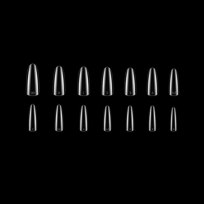 Set of clear round-shaped nail tips on a black background