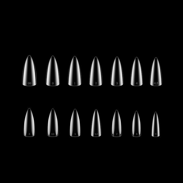 Set of clear stiletto-shaped nail tips on a black background