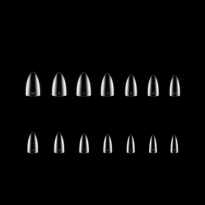 Set of clear stiletto-shaped nail tips on a black background