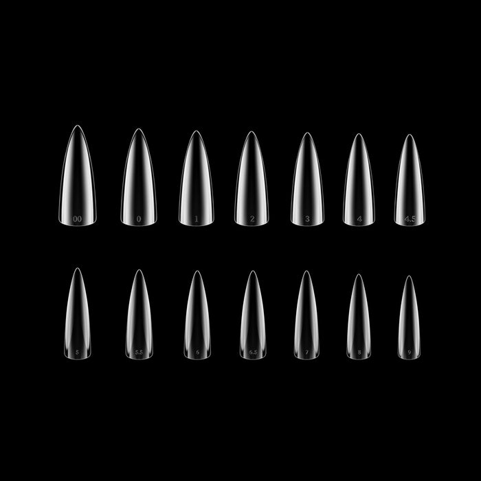 Set of clear stiletto-shaped nail tips on a black background