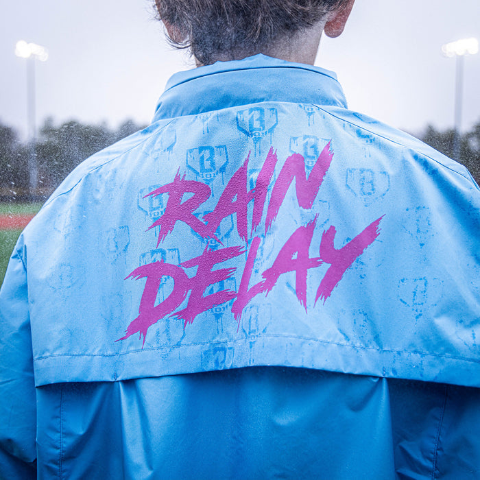Youth model wearing blue Rain Delay Jacket Cotton Candy Blue youth jacket