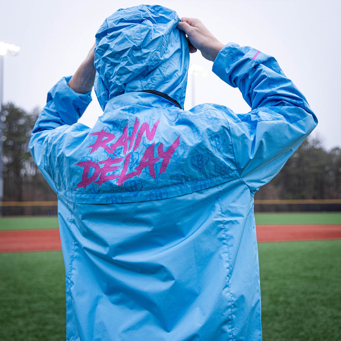 Youth model wearing blue Rain Delay Jacket Cotton Candy Blue youth jacket