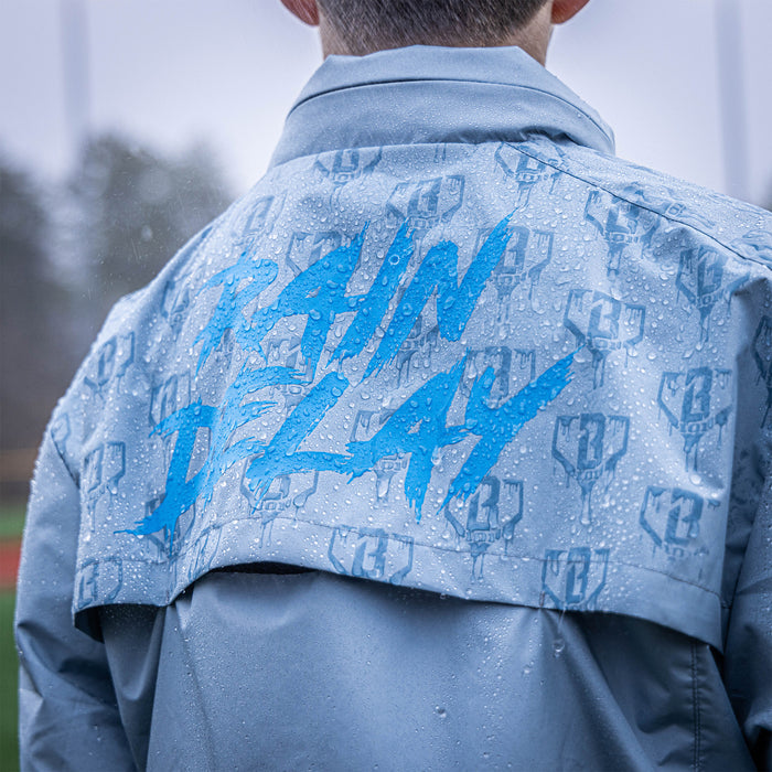 Adult model wearing gray Rain Delay Jacket jacket