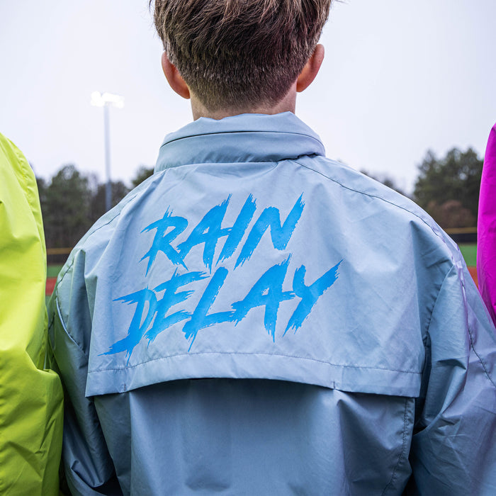 Adult model wearing gray Rain Delay Jacket jacket