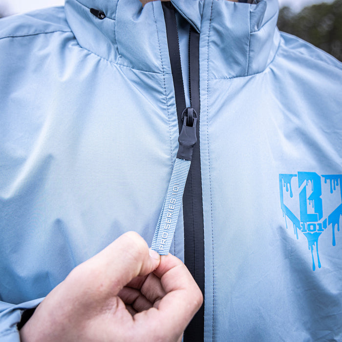 Adult model wearing gray Rain Delay Jacket jacket