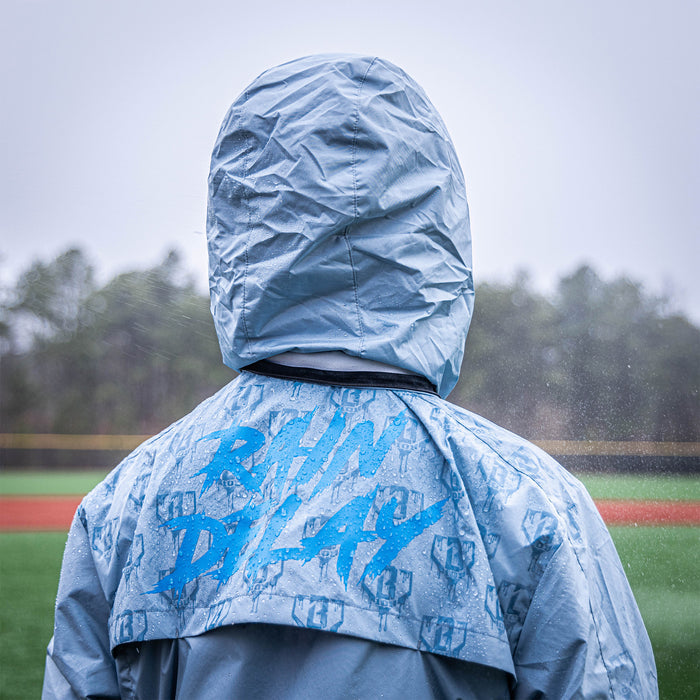 Adult model wearing gray Rain Delay Jacket jacket