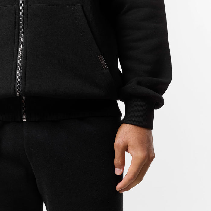 Branded detailing on kangeroo pocket of black zip-up hoodie
